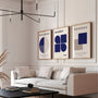 navy and beige geometric bauhaus poster set in contemporary office