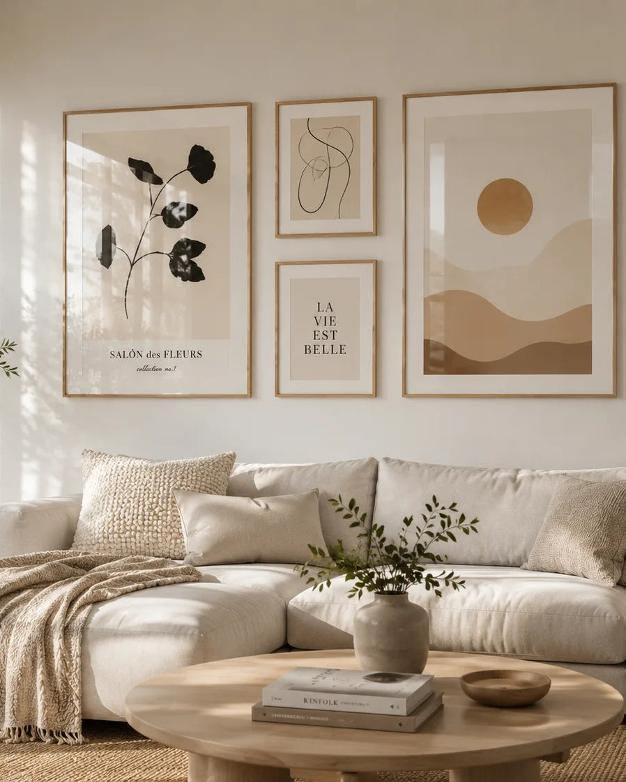 Scandinavian living room with modern framed wall art gallery above a beige sofa