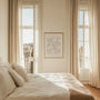 Minimalist floral beige poster displayed in gallery wall with modern neutral interior